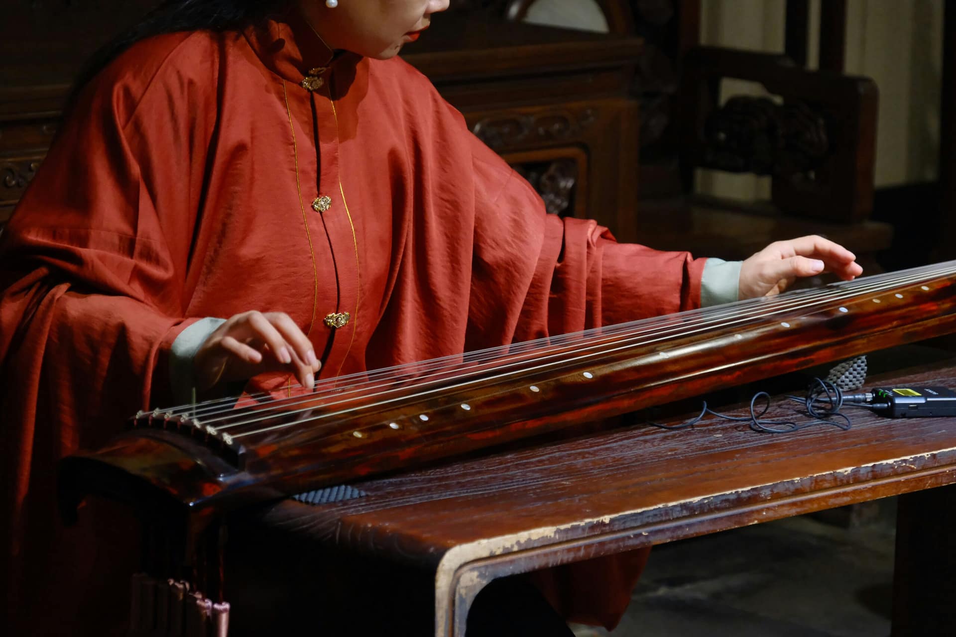 A guzheng being played at a traditional garden in Suzhou, China