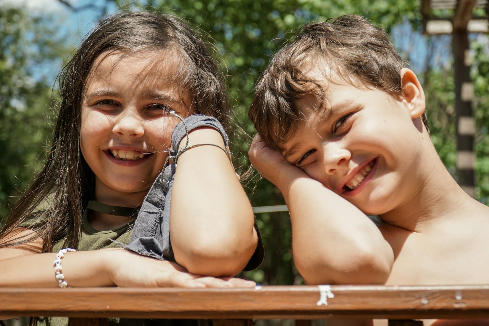 Two children smiling while learning Mandarin together
