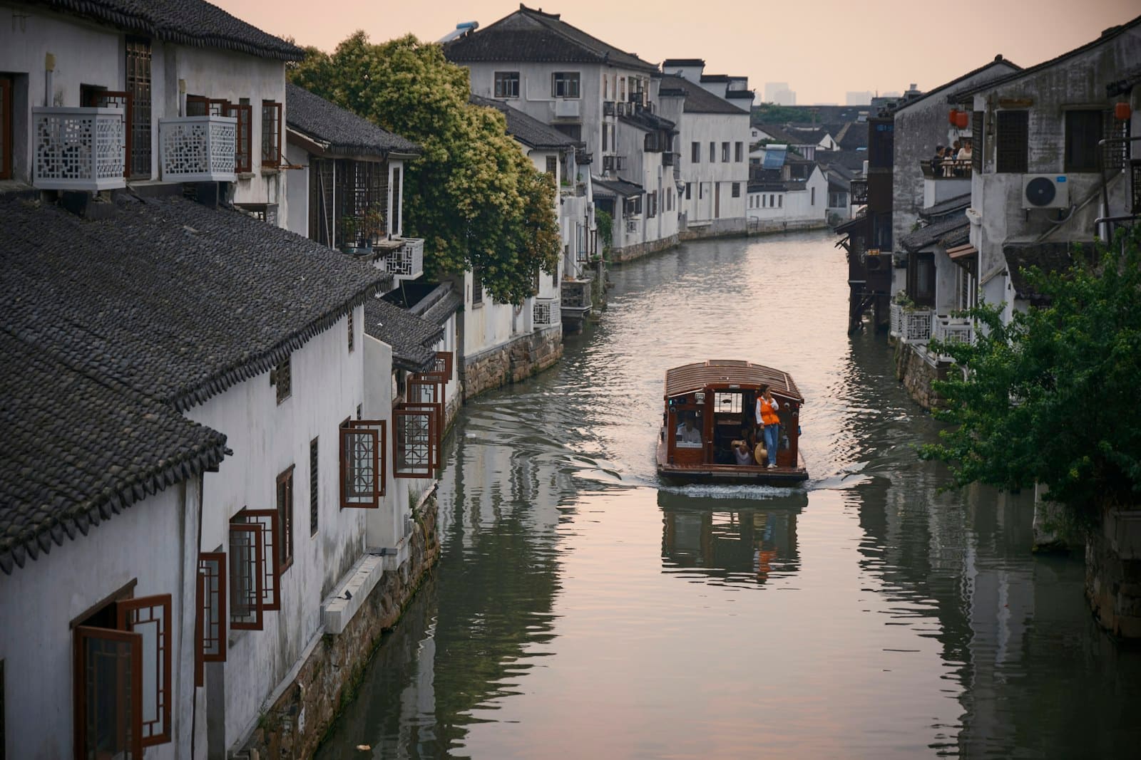 Traditional canal houses reflected in still water, Jiangsu, China