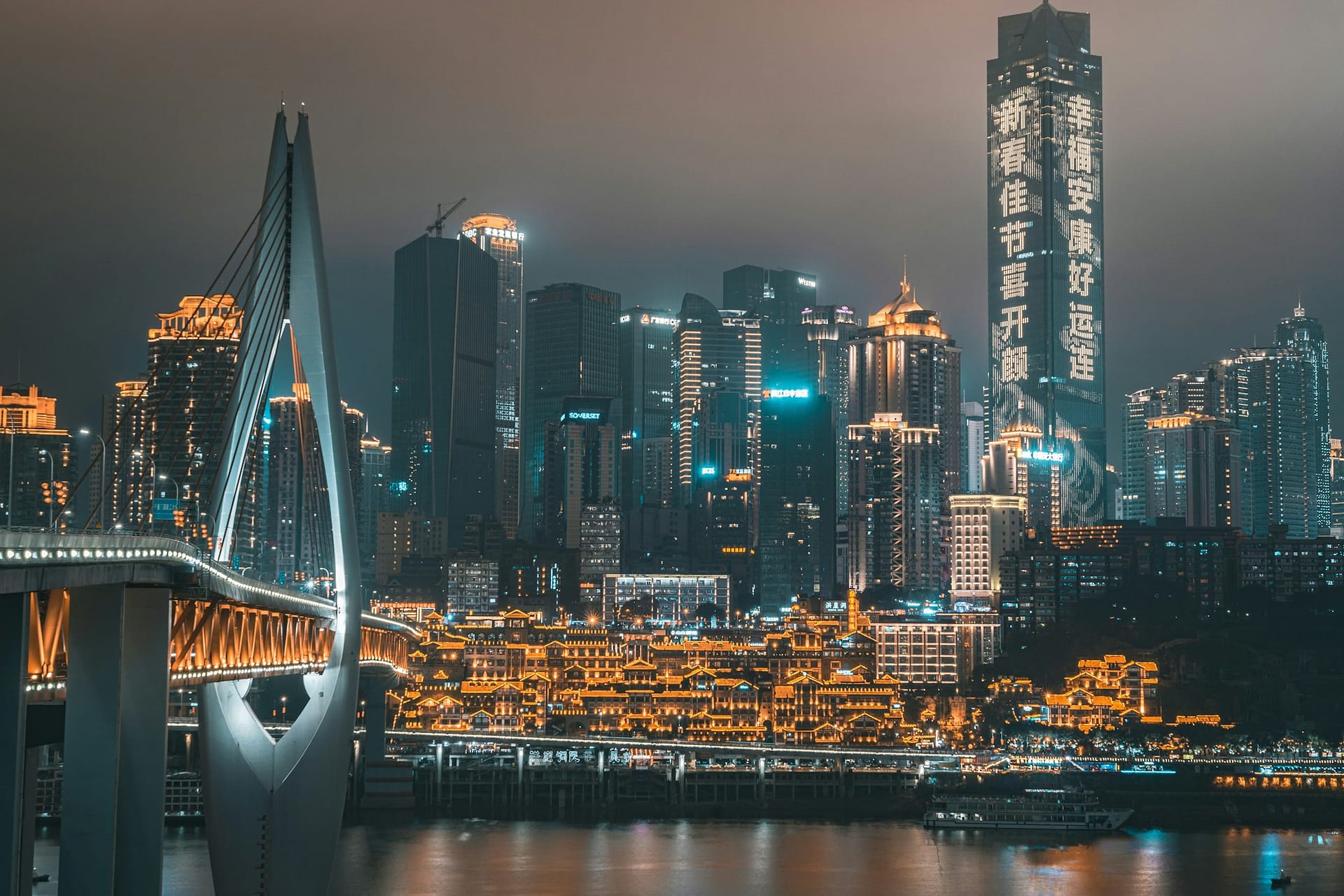 Chongqing’s riverside skyline lit up at night above the Yangtze